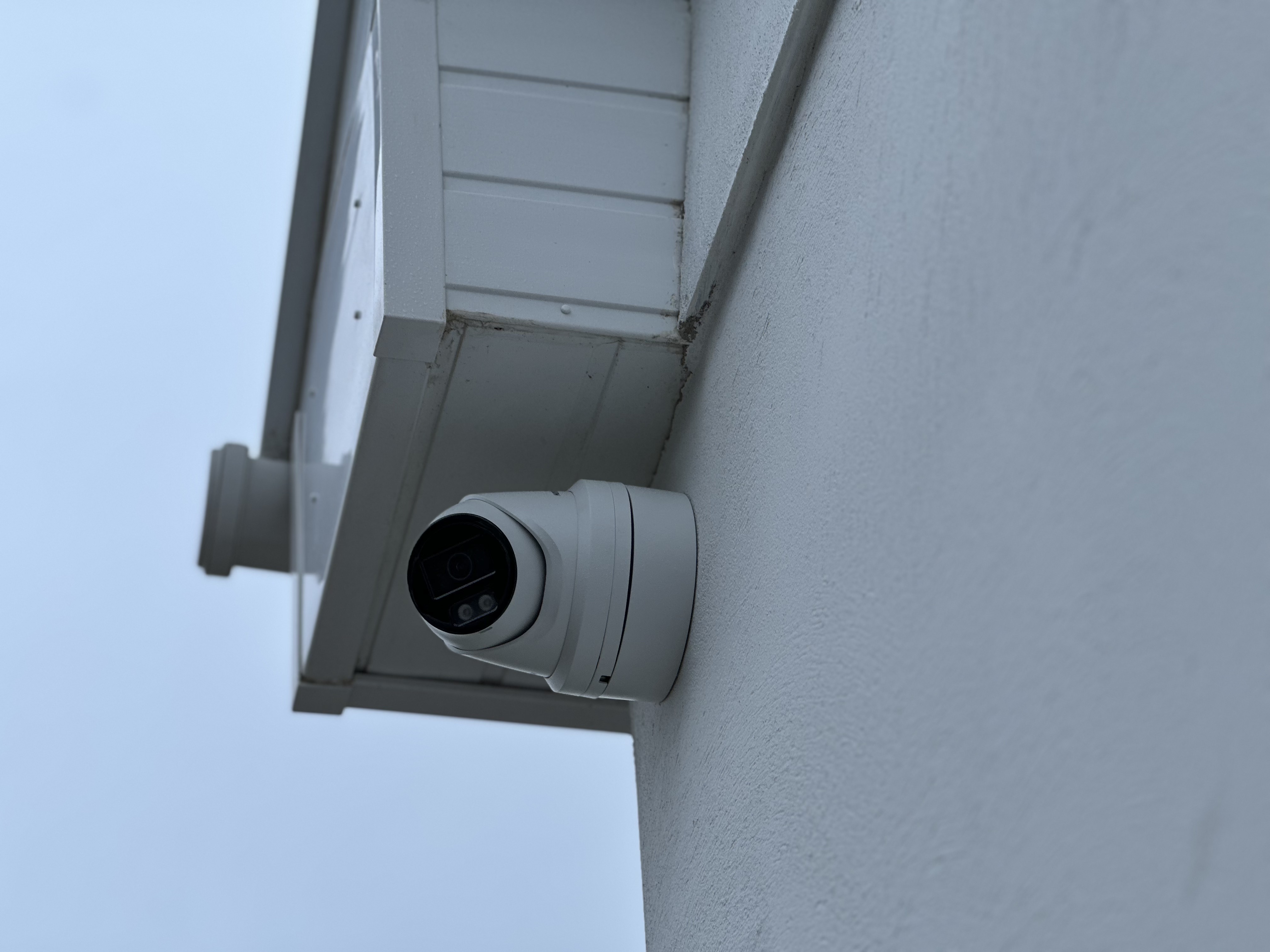 Hikvision turret camera fitted beneath a roofline