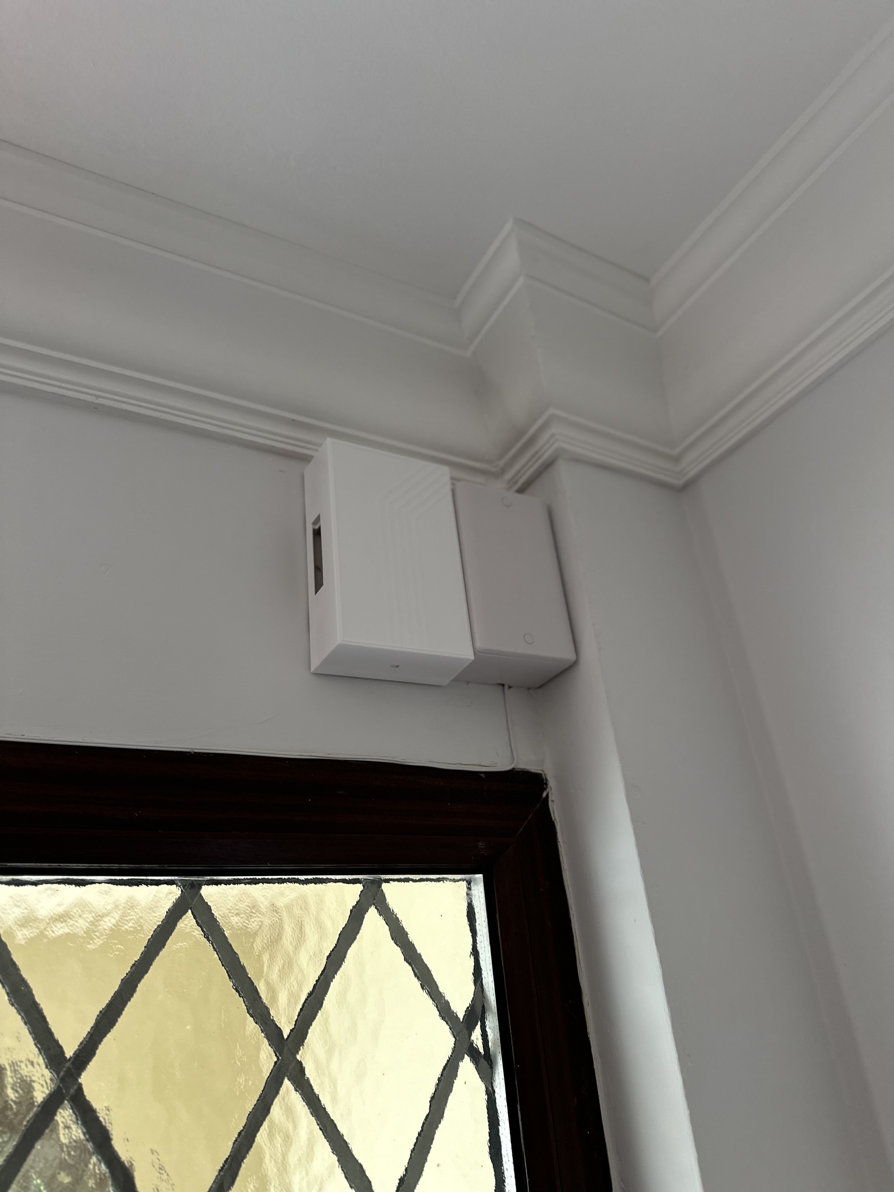 Neatly installed indoor security equipment near an entrance