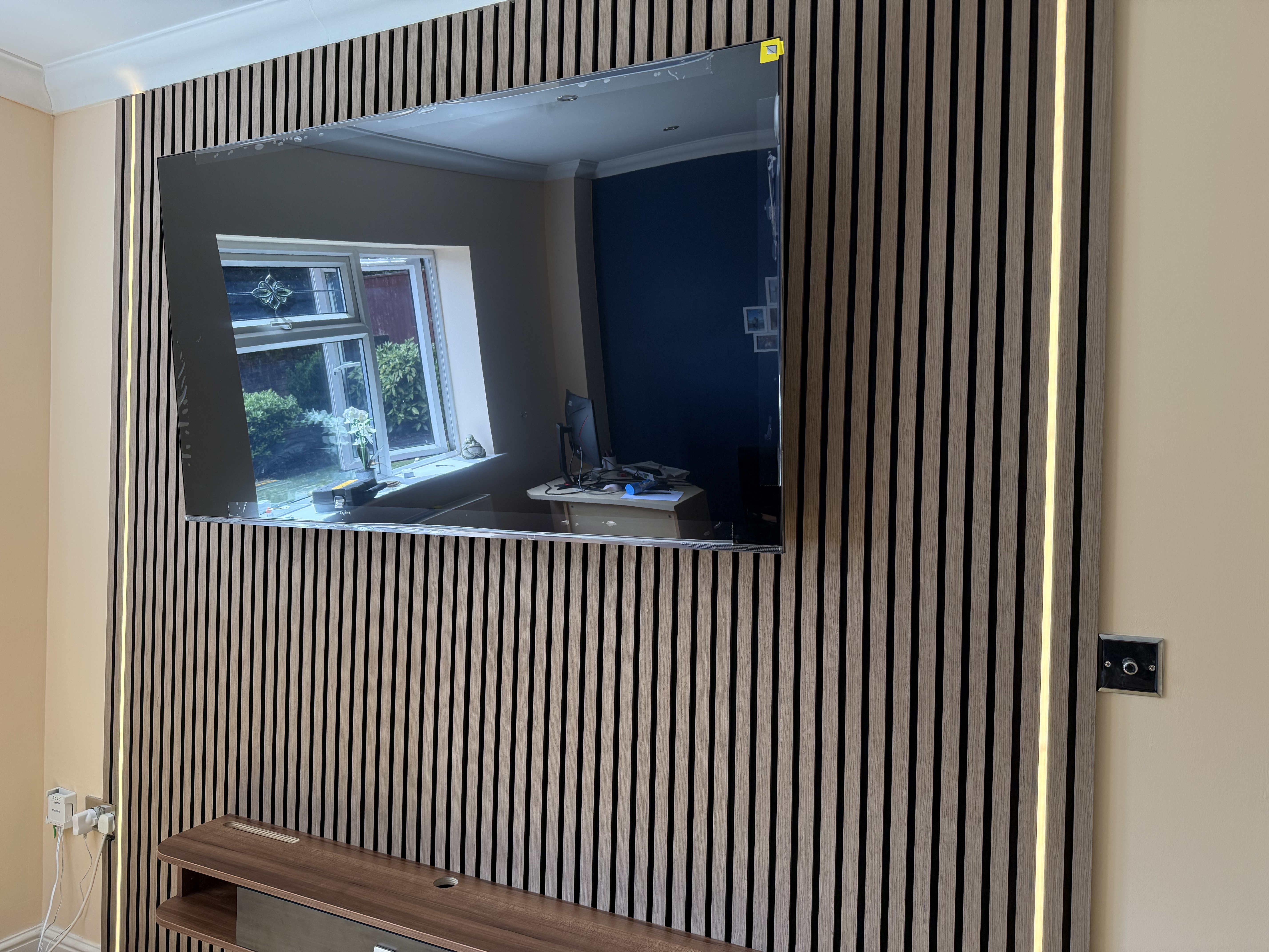 Wall-mounted television on a finished feature wall